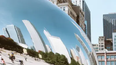 Close-up of Cloud Gate reflecting the Chicago skyline on a sunny day.