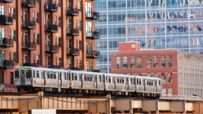 Chicago train traveling on elevated tracks through the city.