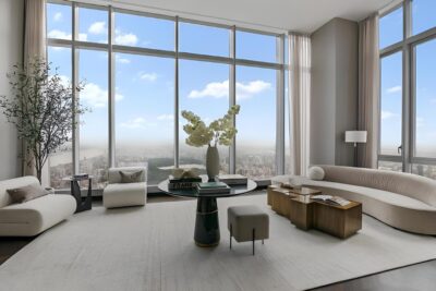 Luxury high-rise condo living room with floor-to-ceiling windows and city views
